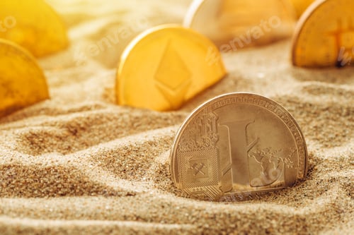 Preview: Silver Litecoin coin in sand