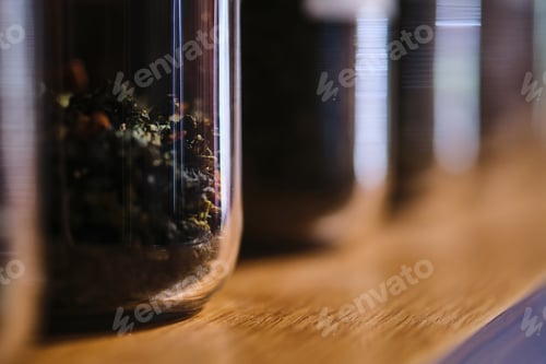 Preview: Glass containers with tea brews. Abstract background.