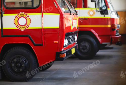 Preview: Ready for action. Cropped shot of parked fire engines.
