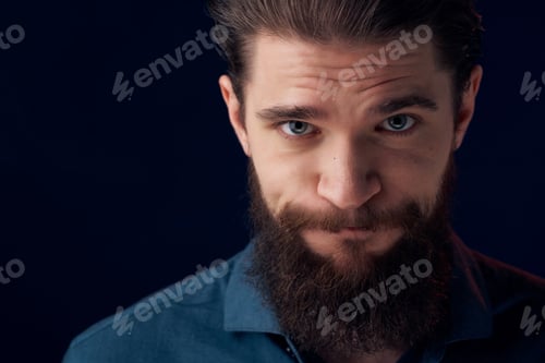 Preview: bearded man in a black shirt smoke clouds dark background