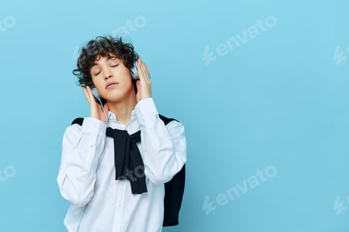 Preview: man technology headphones in a white shirt with sweater isolated backgrounds