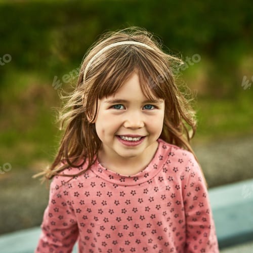 Preview: The world for kids are full of fun. Portrait of an adorable little girl having fun outdoors.