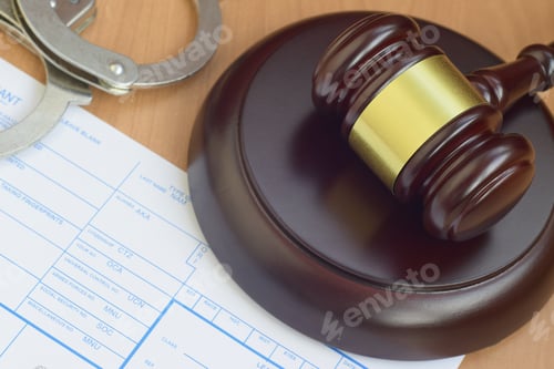 Preview: Justice mallet and Applicant or fingerprints card with police handcuffs close up