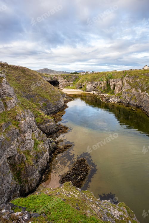 Preview: Scenic view of a tranquil pond situated next to Smoo Cave in Durness, United Kingdom