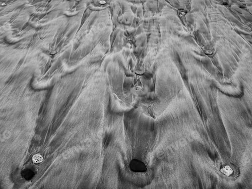 Preview: Grayscale shot of stone texture in the sand