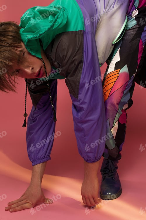 Preview: A Guy Hipster In A Sports Suit Posing On A Pink Background