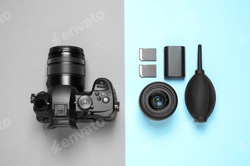Preview: Flat lay composition with camera and video production equipment on color background
