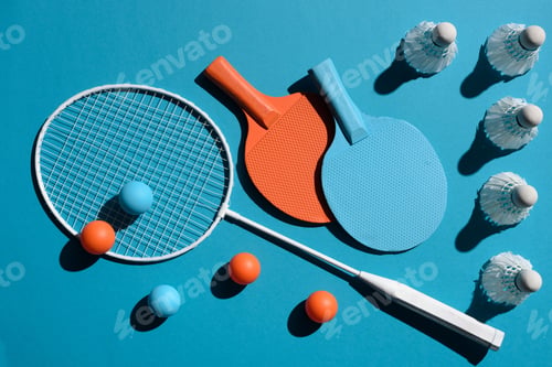 Preview: colourful ping pong and badminton equipment placed on blue surface