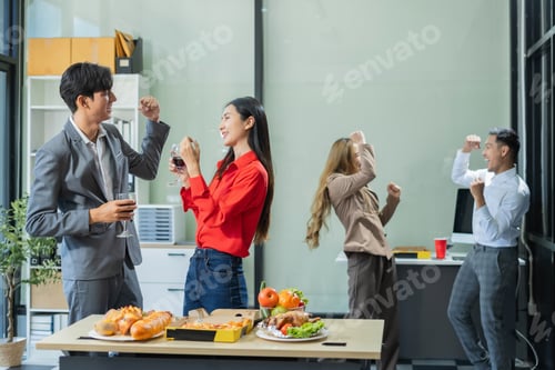 Preview: celebration successful deal with champagne and pizza in the workplace.