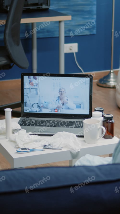 Preview: Sick adult having medical consultation with doctor on video call