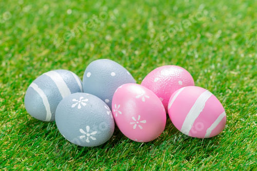 Preview: Colorful painted eggs on green grass for spring celebration activities