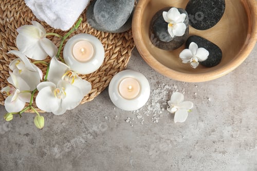 Preview: Flat lay composition with spa stones and candles on gray table