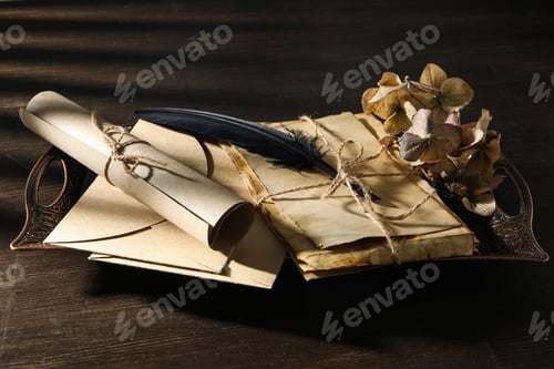Preview: Vintage tray with old letters and feather on wooden background