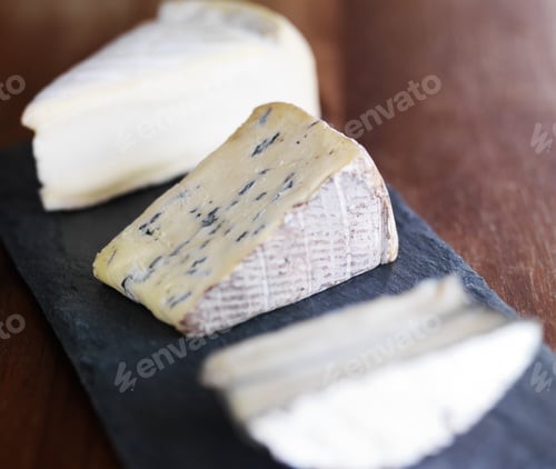 Preview: assorted gourmet cheese on slate serving tray
