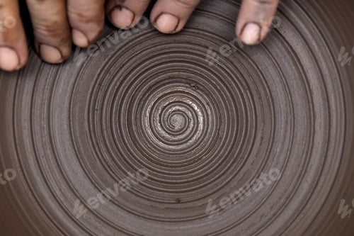 Preview: Artist makes clay pottery on a spin wheel