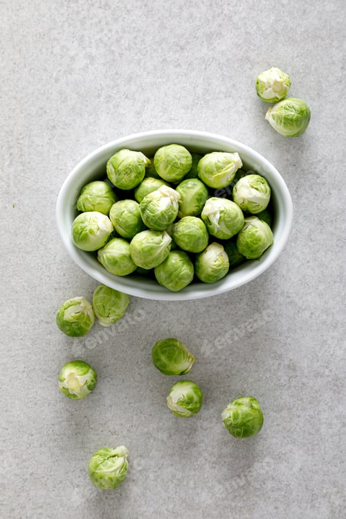 Preview: Fresh green brussels sprouts on cooking kitchen table. Top view