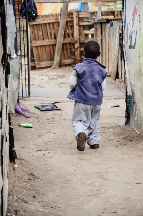 Preview: Black young boy walking on a rural street