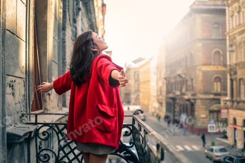 Preview: Woman Enjoying Fresh Air on Balcony in City