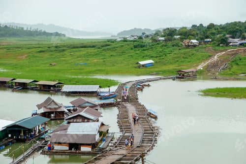 Preview: Tourist walking on village antique and wooden bridge traditional culture in dam