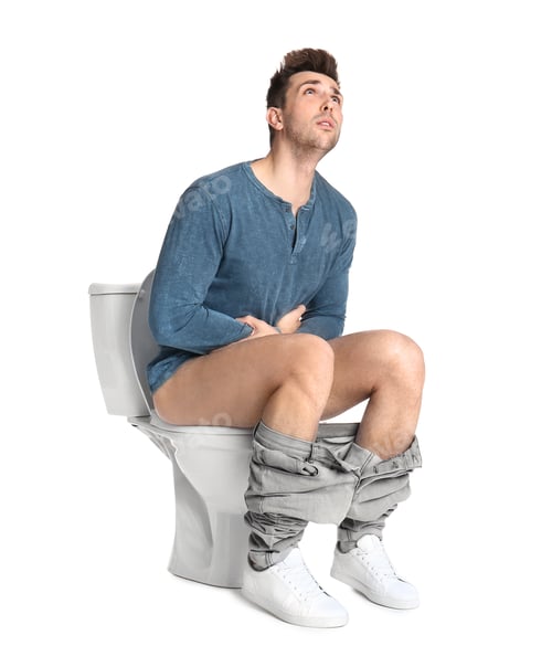 Preview: Man suffering from stomach ache on toilet bowl, white background