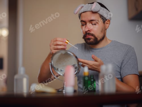 Preview: Men's beauty concept. caucAsian guy checking his skin.