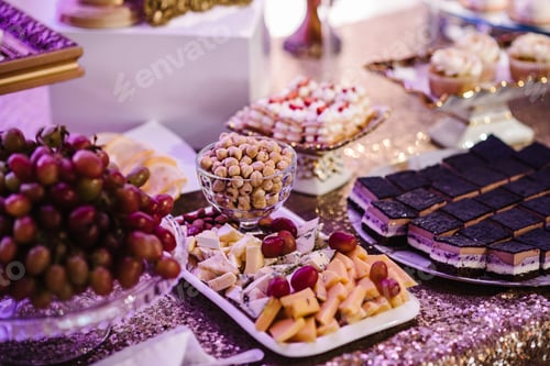 Preview: Delicious wedding reception candy bar dessert table.