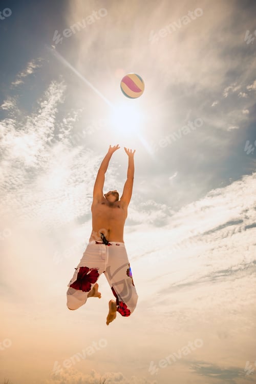 Preview: male beach volleyball game player jump on hot sand