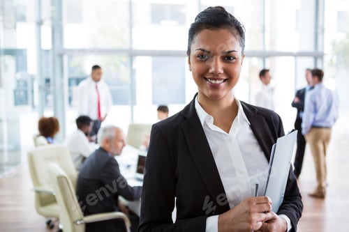 Preview: Smiling businesswoman in office
