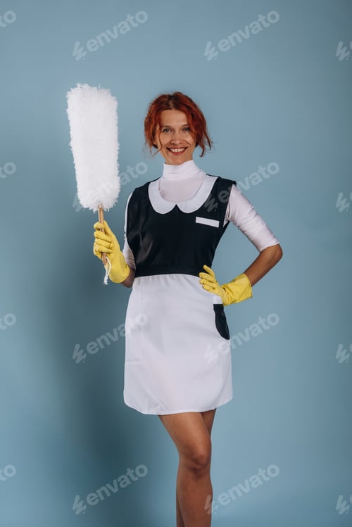 Preview: Maid is with dust brush. Woman is in the studio against background