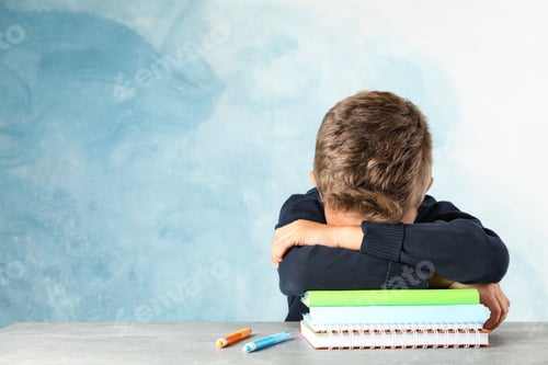 Preview: Boy sleeps on notebooks heap against color background, space for text