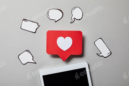 Preview: digital tablet with paper like sign, thought and speech bubbles on white surface