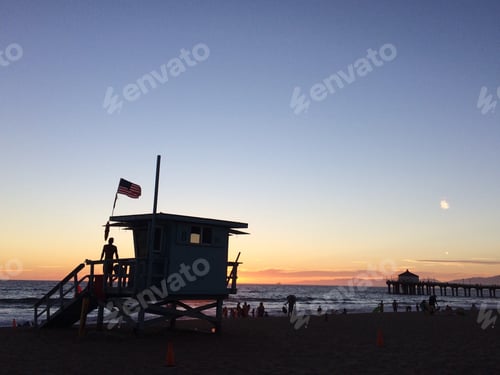 Preview: Beach at Sunset with Lifeguard Tower and Pier