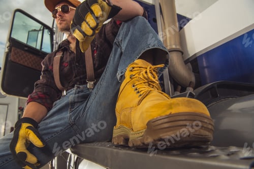 Preview: Truck Driver Resting Outdside Of Vehicle Cab.