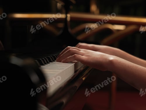 Preview: Close up of girls hands playing piano keys