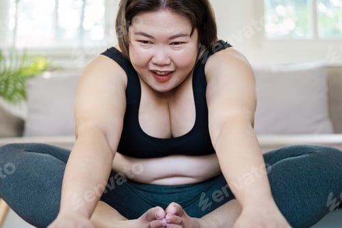 Preview: Confident Overweight Woman Exercising at Home, Embracing a Healthy Lifestyle with Enthusiasm and