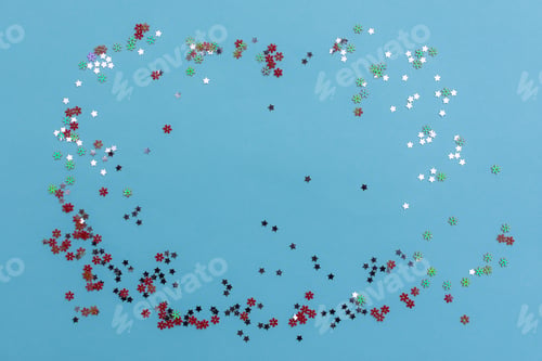 Preview: Red and silver sequins on a blue background.