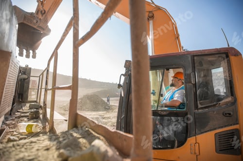 Preview: Construction worker operating heavy machinery at a work site