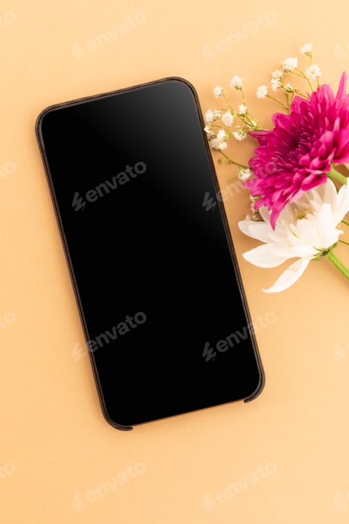 Preview: Smartphone with blank screen and pink and white flowers on yellow background