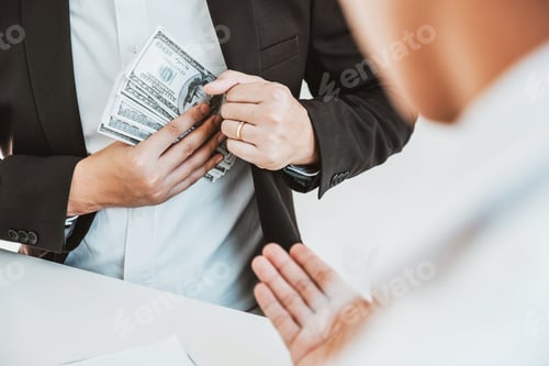 Preview: Corruption concept,Business man passing money dollar bills corruption bribery to businessman manager