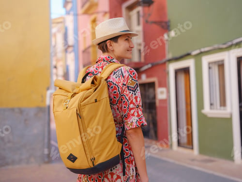 Preview: Woman strolls through colorful streets of Spanish coastal town