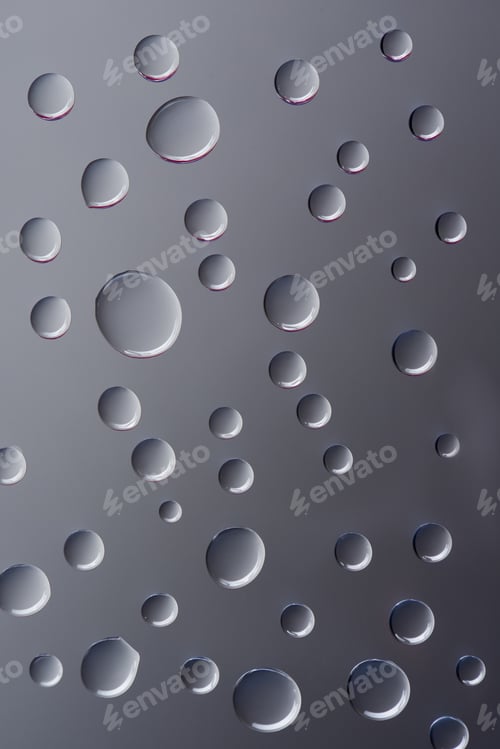 Preview: close-up view of transparent clear droplets on grey background