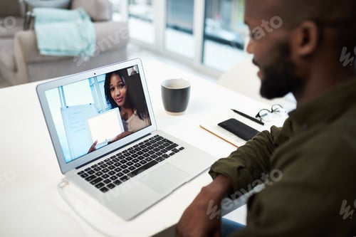 Preview: Shot of a young man using a laptop to have an online lesson via video conference