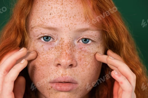 Preview: Portrait of a red-haired girl with freckles