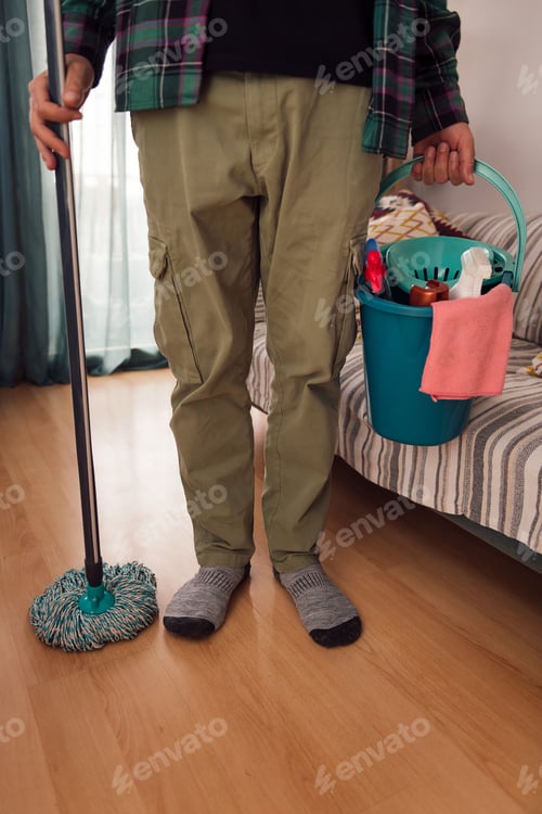 Preview: man holding mop and bucket with cleaning products