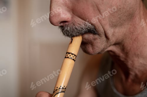Preview: senior man playing flute. unprofessional male elderly recorder people with moustache play on pipe