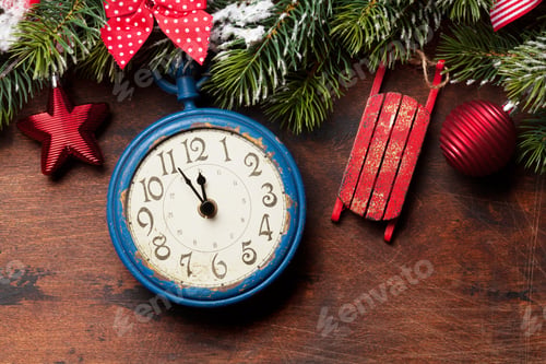 Preview: Christmas fir tree and alarm clock over old wood