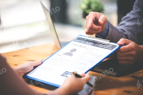 Preview: Woman submits her employer's resume to review job applications. Concept showcases her ability to get