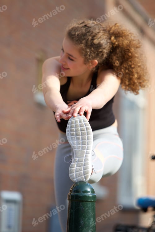 Preview: Female teenager stretching leg muscle exercise