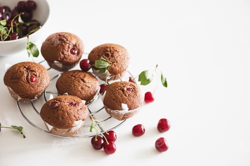 Preview: Cherry Muffins with Cherries on a White Surface