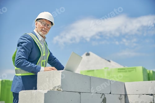 Preview: Man in eyeglasses working at a laptop